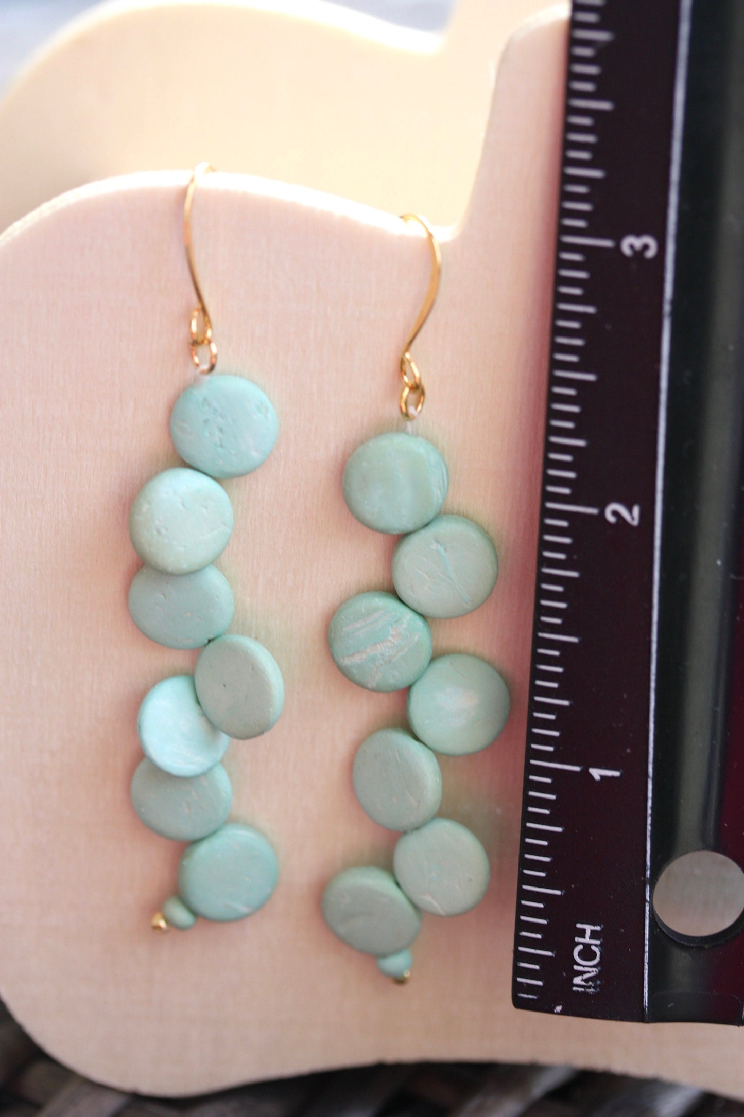 Handsewn aqua tinted wooden disk Scandinavian-inspired earrings - with sloped goldstone ear wires