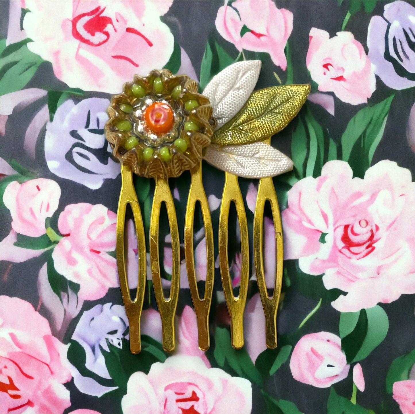 Small 1" hair comb featuring beaded mixed medium upcycled metal floral crown trimmed with satin green and white leaves.