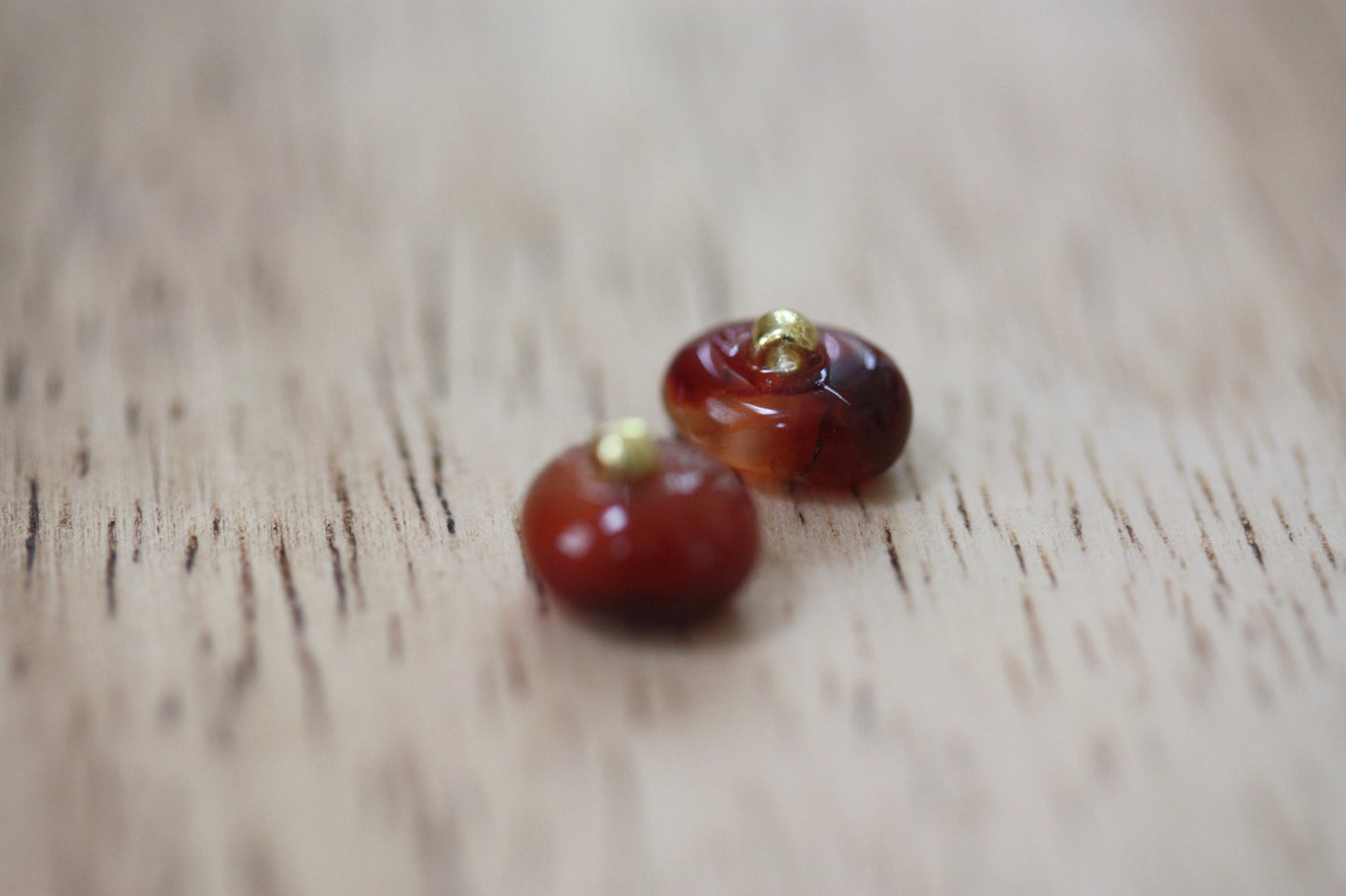 Small little orange glass stud earrings