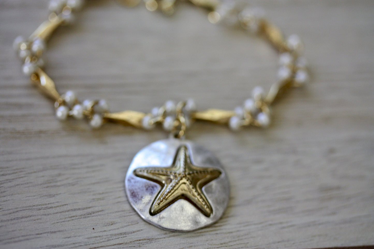 Handmade bracelet made with upcycled / repurposed vintage silver tone and gold tone starfish dangle, charm bracelet