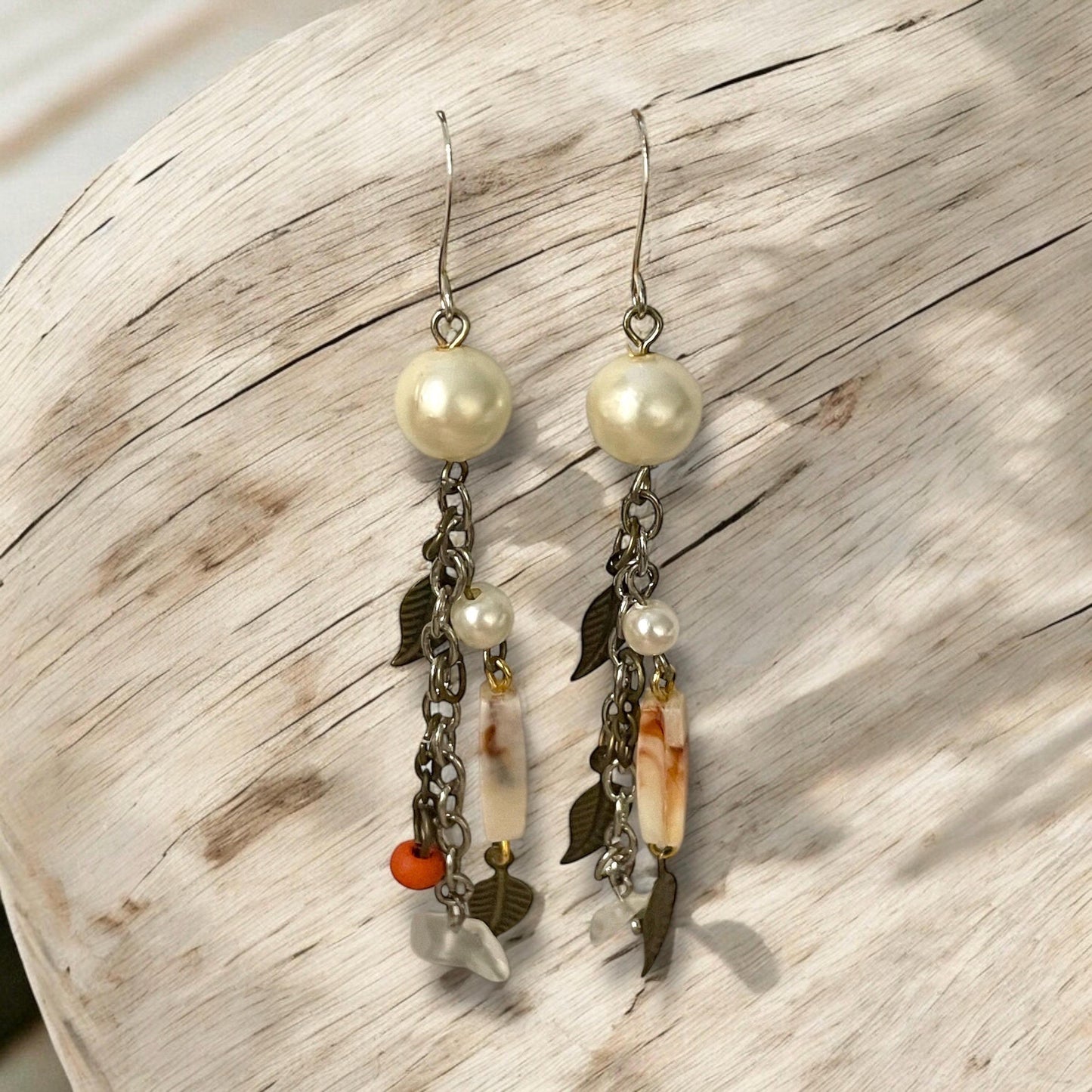 Collage inspired earrings - mixed materials including vintage metal leaves, orange wood, chain, faux pearls and ivory faux bone spacers