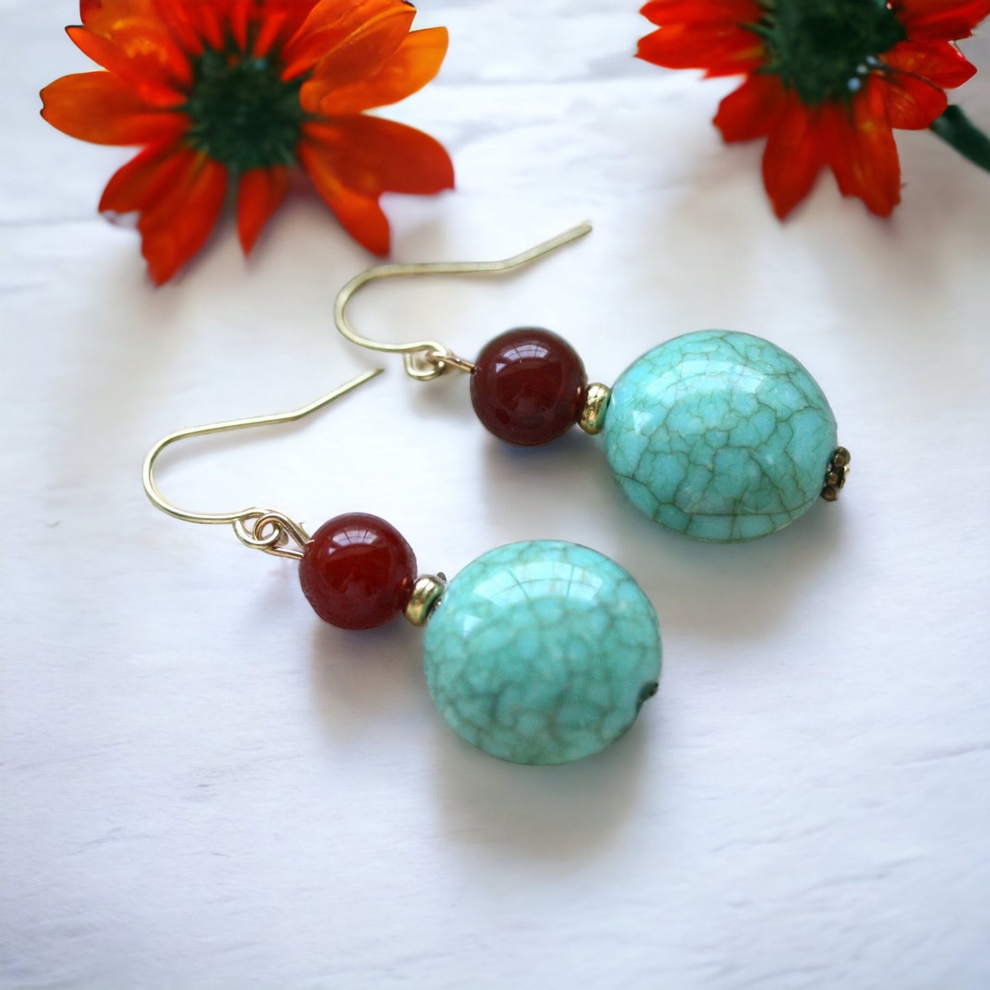 Dangle earrings made of faux turquoise and deep red glass