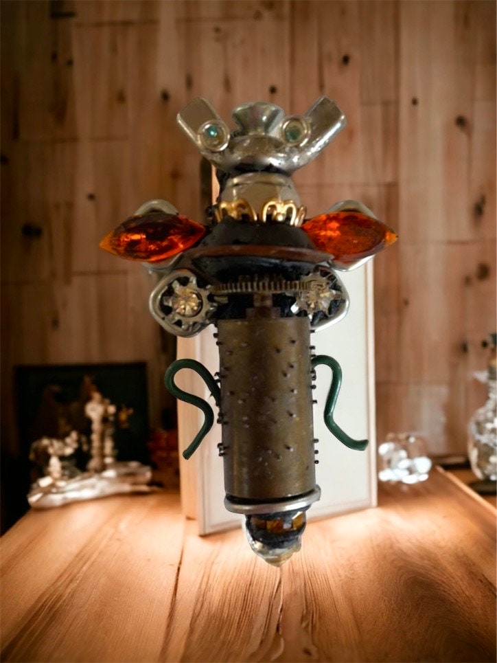 Meet "Scout" , a mixed material insect made of parts of a vintage Swiss music box, along with nails, screws, bolts - pin or necklace pendant