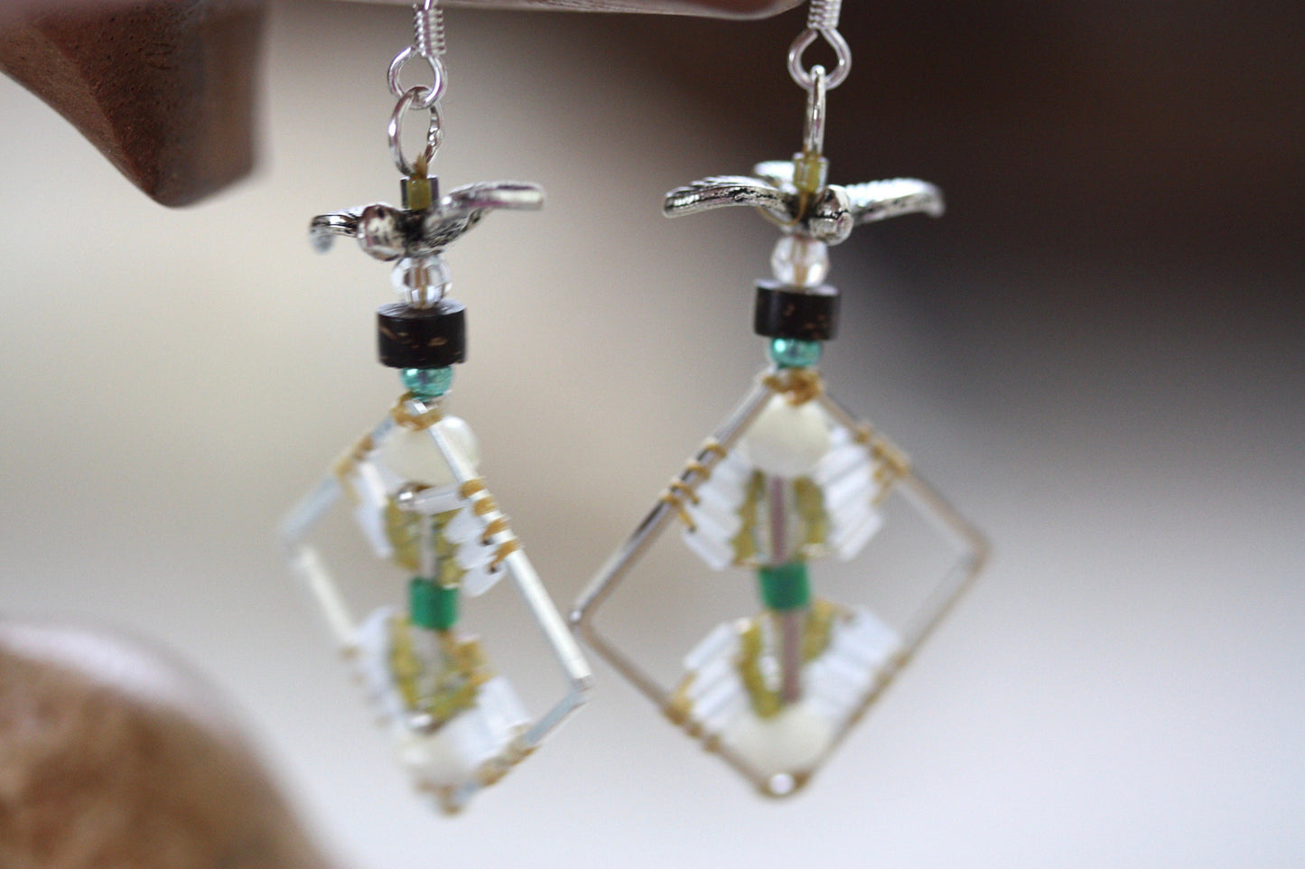 Birds taking flight - intricate beadwork seed bead dangle earrings on diamond-shaped base with flying bird embellishments
