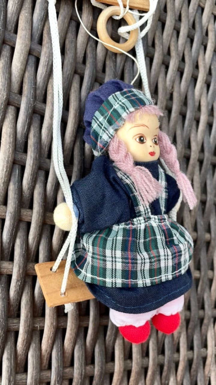 Little porcelain girl doll on swing dangling figurine by Lidco
