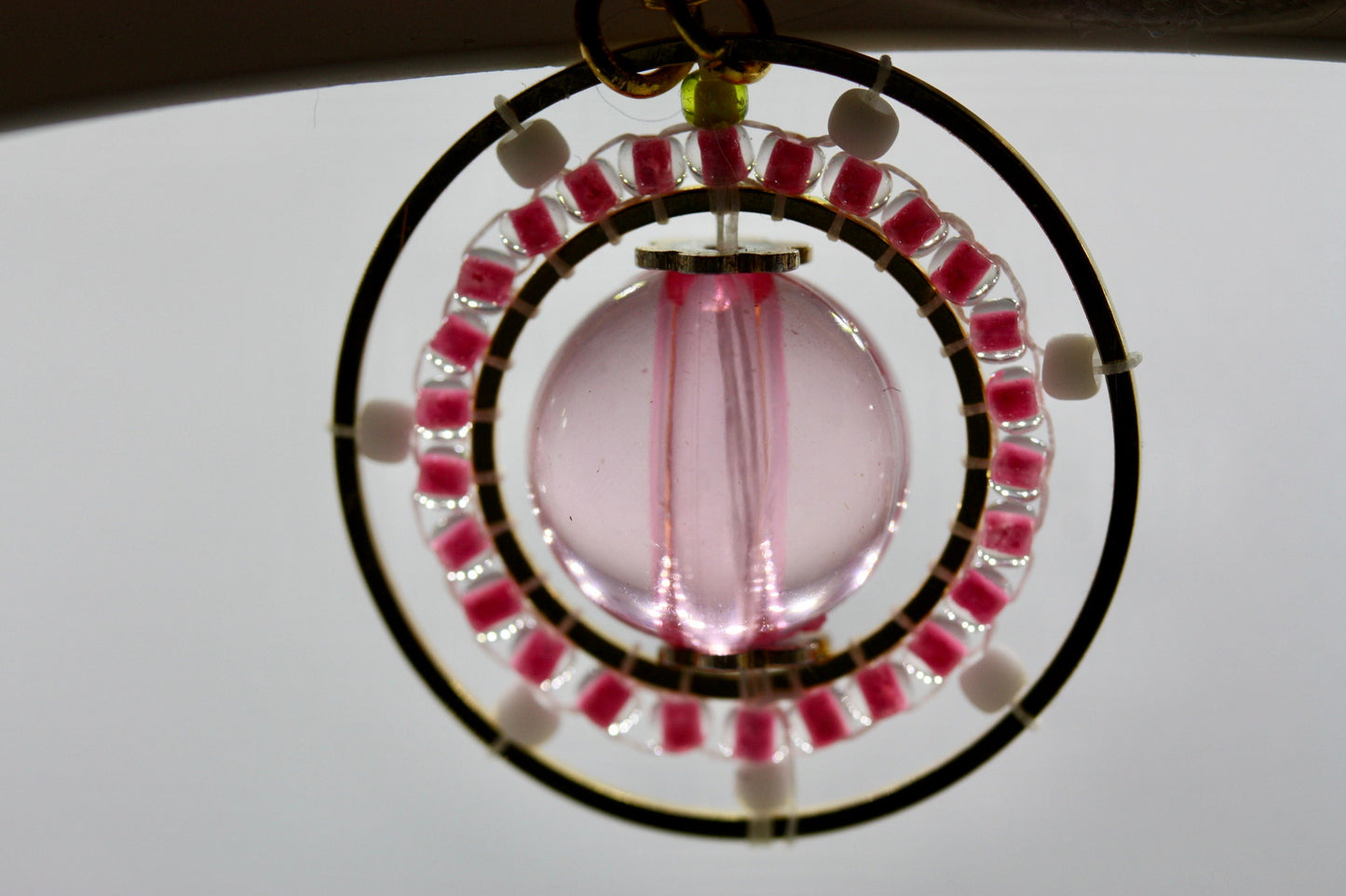 Pink and white intricate beadwork small circular dangle earrings
