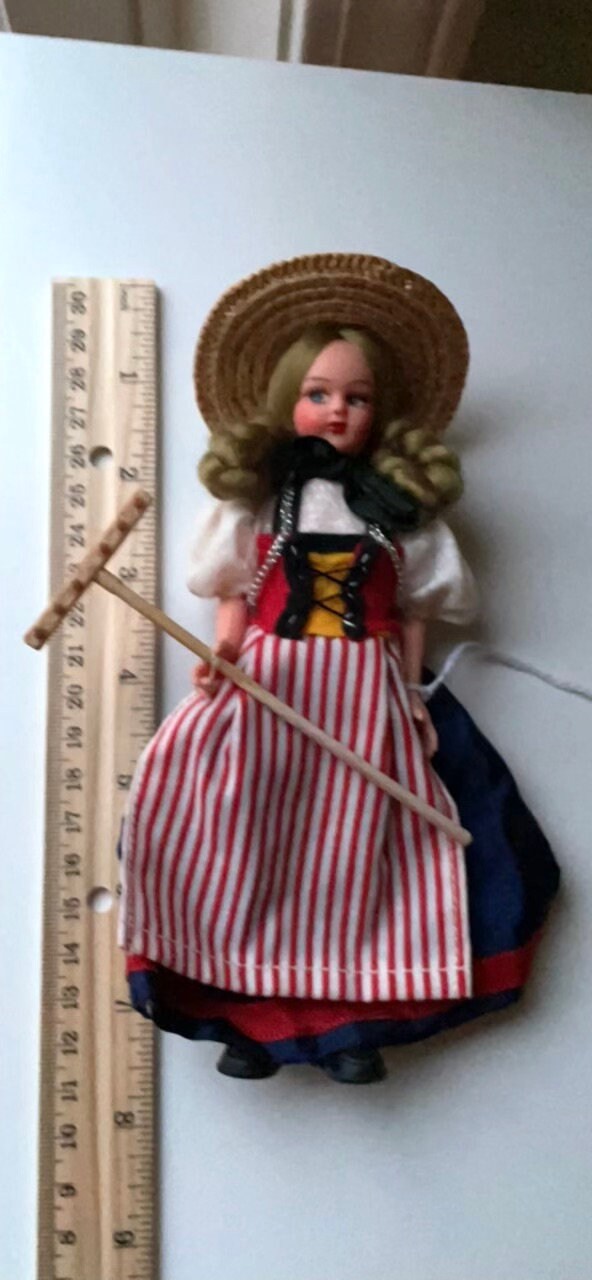 Vintage collectible handmade doll from Luganos Switzerland - with traditional handmade clothing and wooden rake