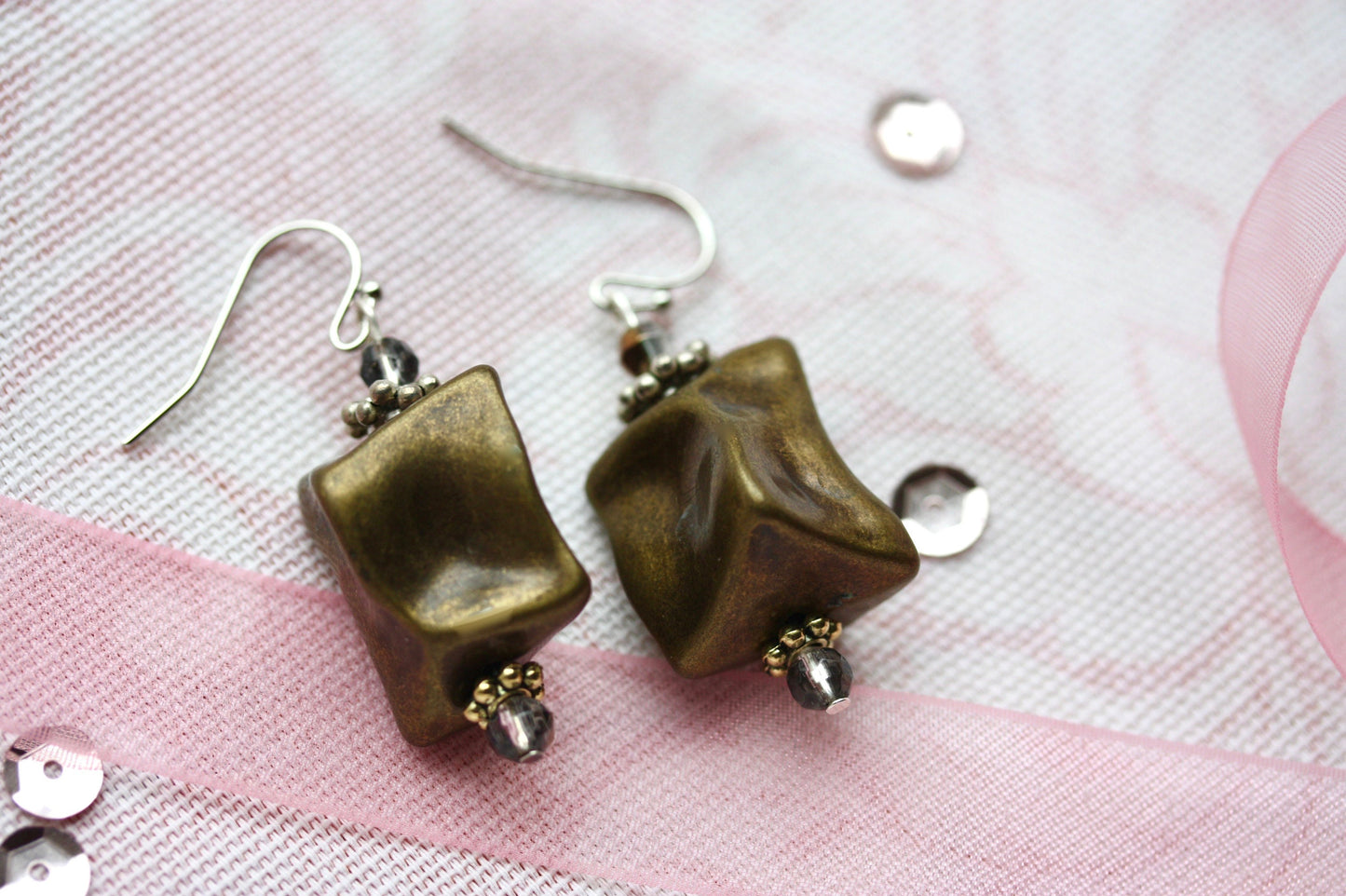 Handmade dangle earrings made with uniquely shaped faux stone beads