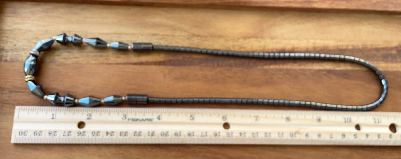 Vintage hematite necklace with uniquely shaped hematite beads and rhinestone spacers