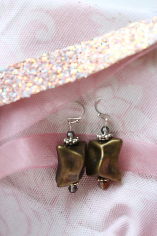 Handmade dangle earrings made with uniquely shaped faux stone beads