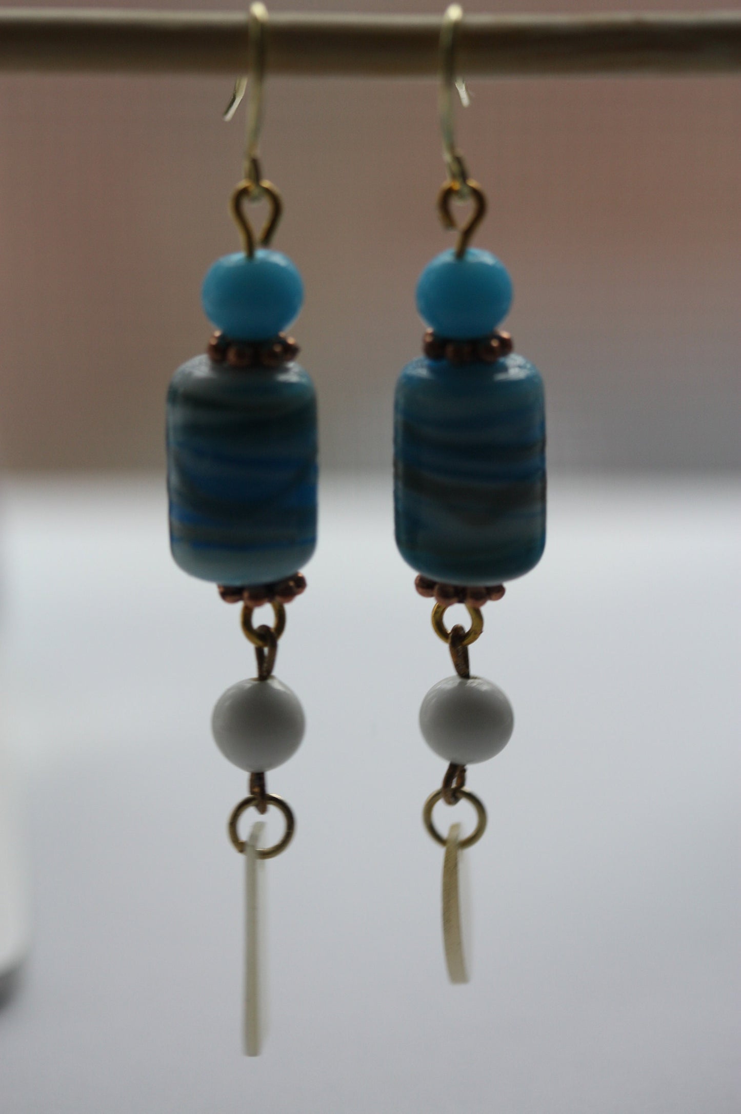 Long dangle earrings made of both new and vintage components -blue and gold art glass, mother of pearl dangles,vintage blue and white beads