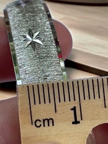 Vintage silvertone bangle bracelet with etched stars