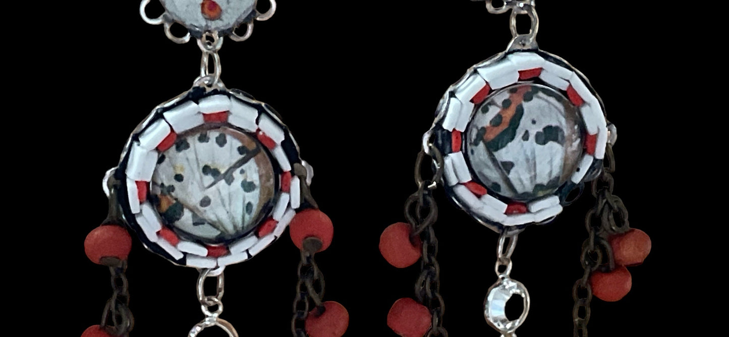 Hand cut micro mosaic millefiori glass dangle earrings surrounding butterfly wing image with orange wood dangles and feather charms