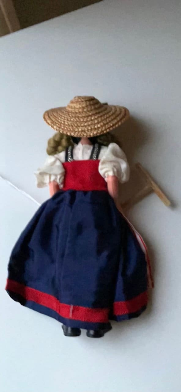 Vintage collectible handmade doll from Luganos Switzerland - with traditional handmade clothing and wooden rake