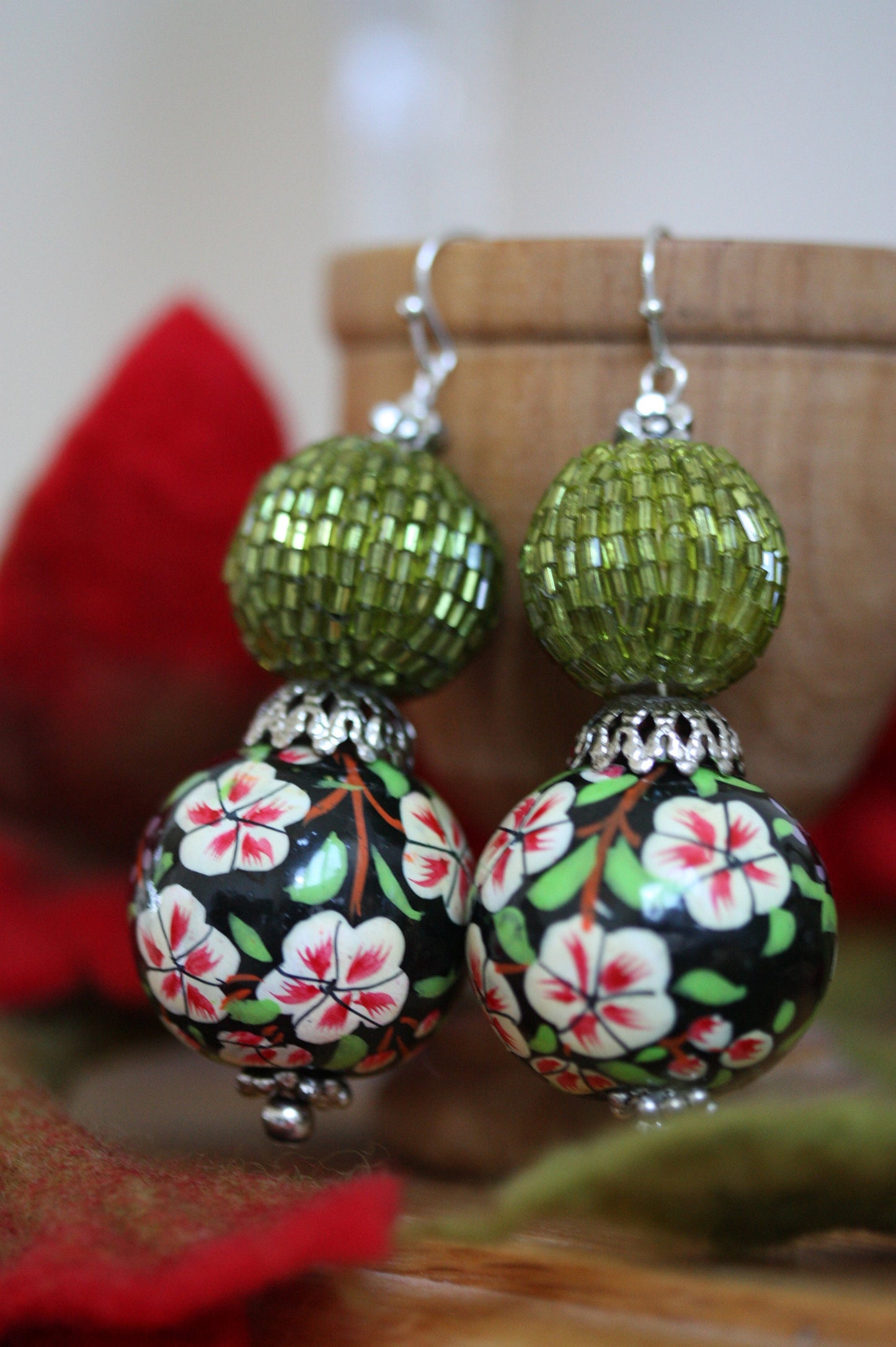 Green beaded bead and floral painted wood dangle earrings