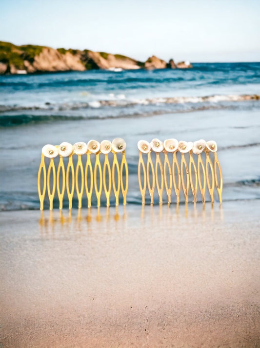 Pair of ivory white shell hair combs with goldtone centers