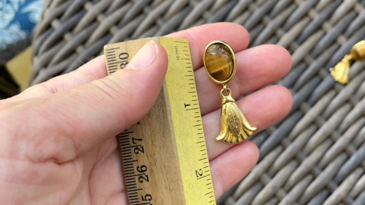 Vintage brown scarab earrings in goldtone setting with goldtone tassel