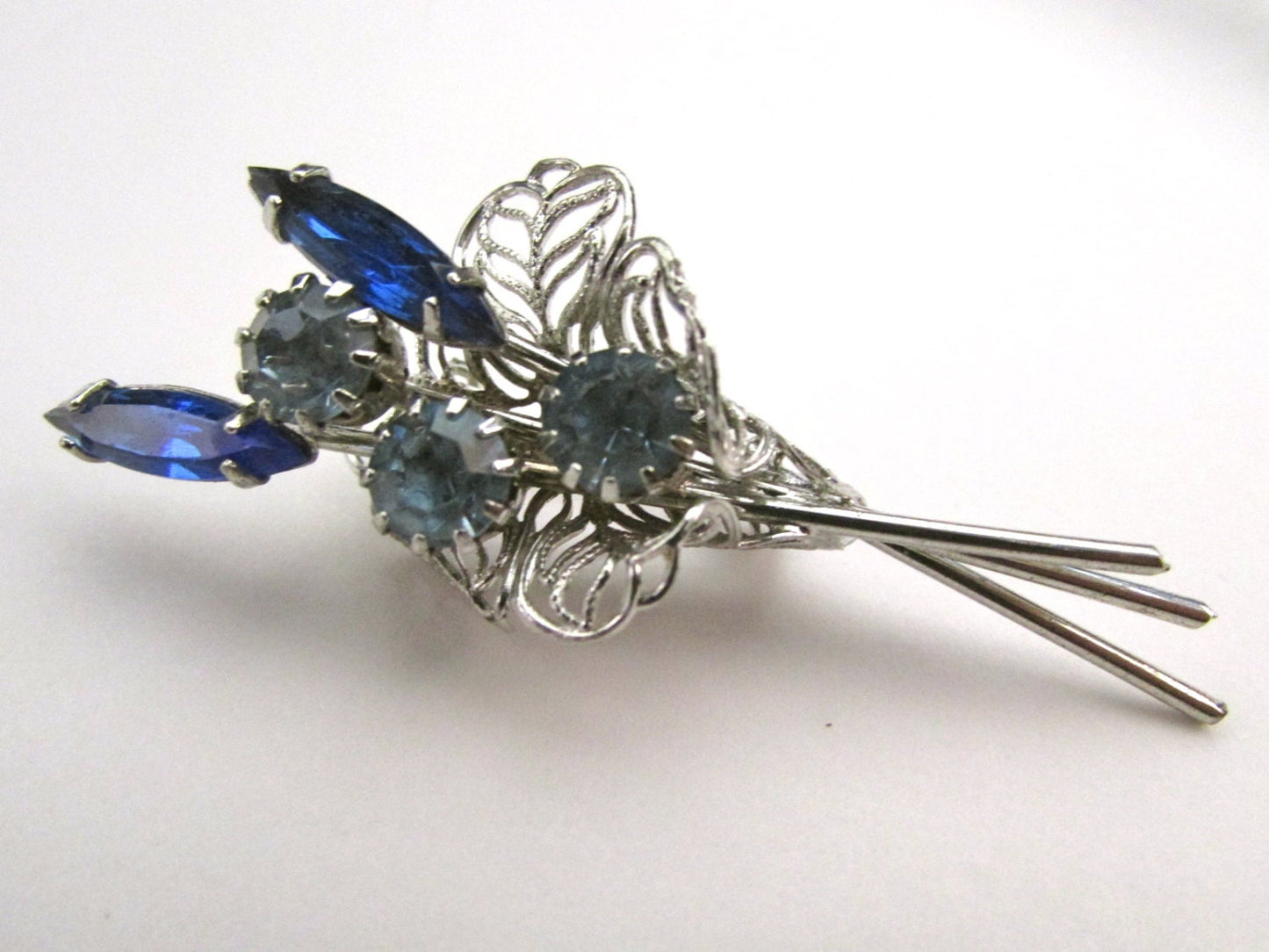 Charming vintage pin -  silver filigree bouquet of beautiful rhinestone & crystal flowers in shades of blue