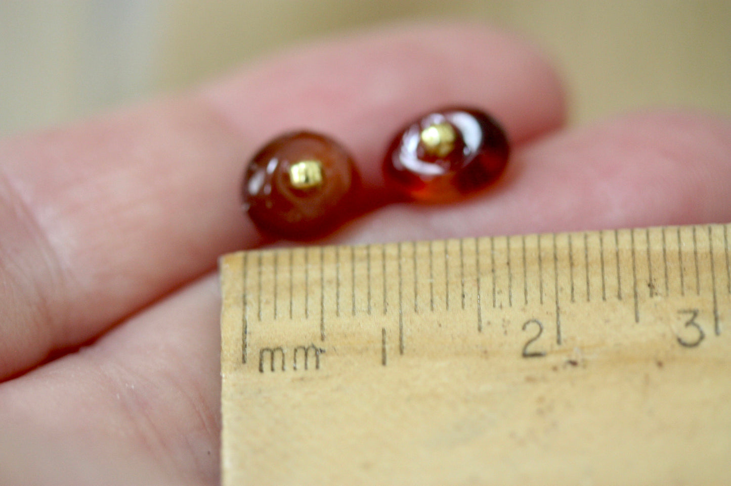 Small little orange glass stud earrings