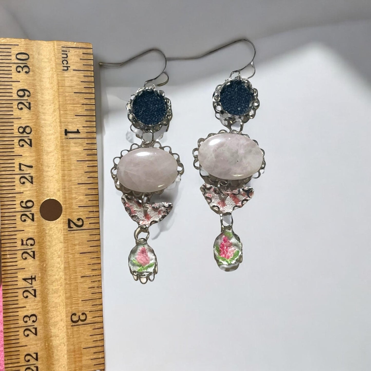 Handmade earrings featuring rose quartz, metal findings, denim, pink dotted fabric, embroidered flowers.  Sterling silver ear wires.