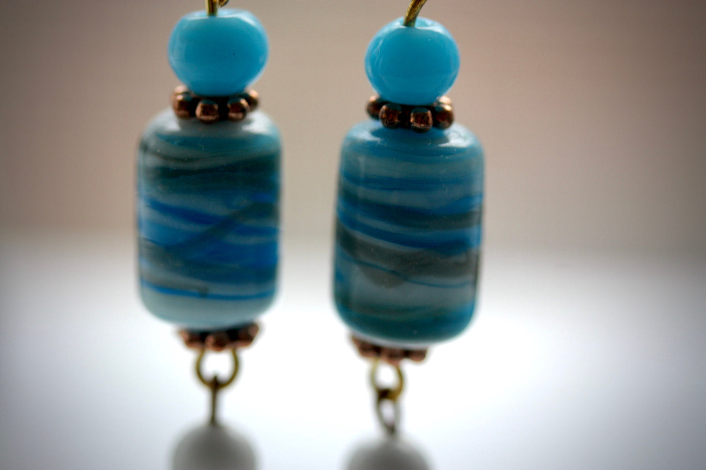 Long dangle earrings made of both new and vintage components -blue and gold art glass, mother of pearl dangles,vintage blue and white beads