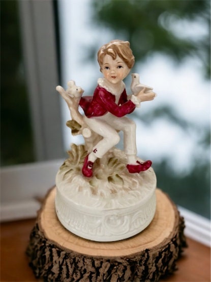 1977 Berman and Anderson stunning porcelain music box - boy dressed in red and white feeding birds
