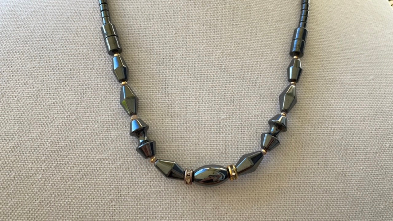 Vintage hematite necklace with uniquely shaped hematite beads and rhinestone spacers
