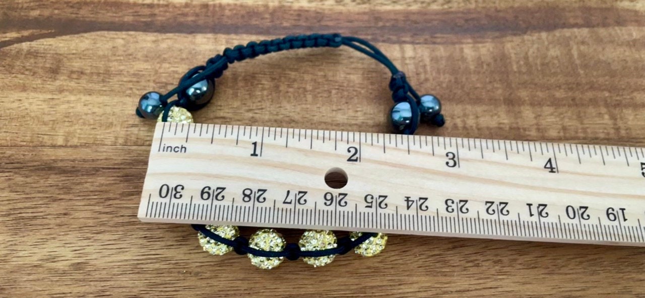Sparkly black and yellow goldtone bracelet with hematite beads - adjustable