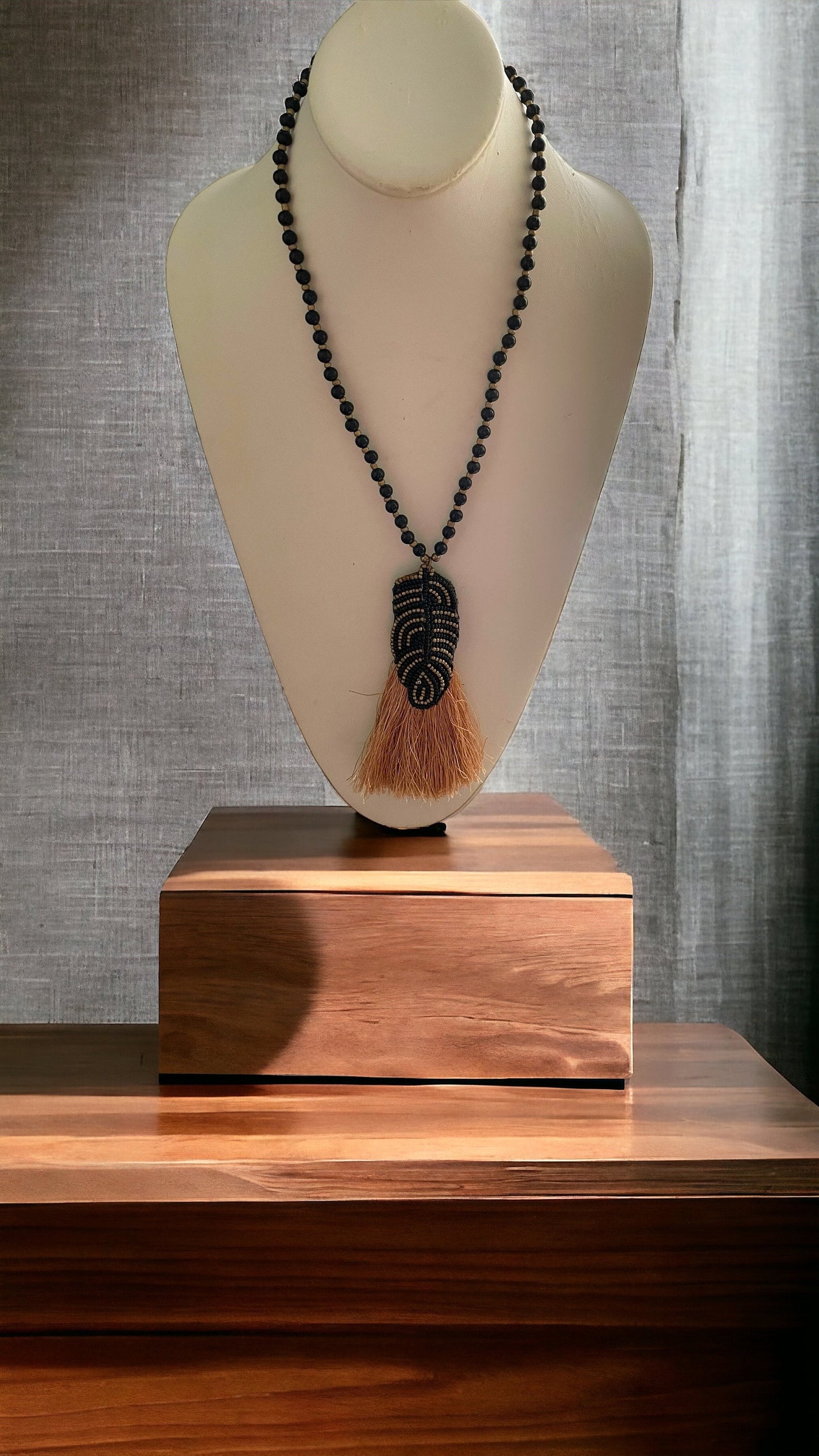 Stunning and unique hand beaded vintage artisan black and gold tassel necklace