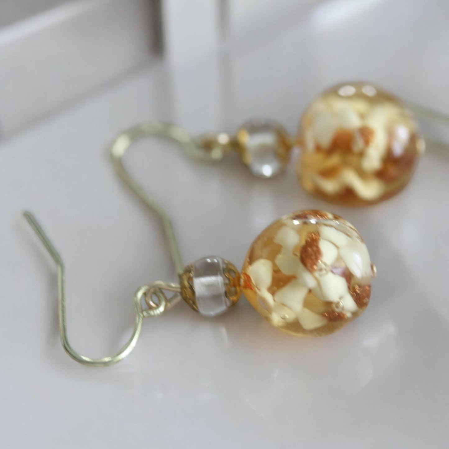 Stunning yellow and gold blown glass earrings with goldstone filigree - 1 and 1/4"