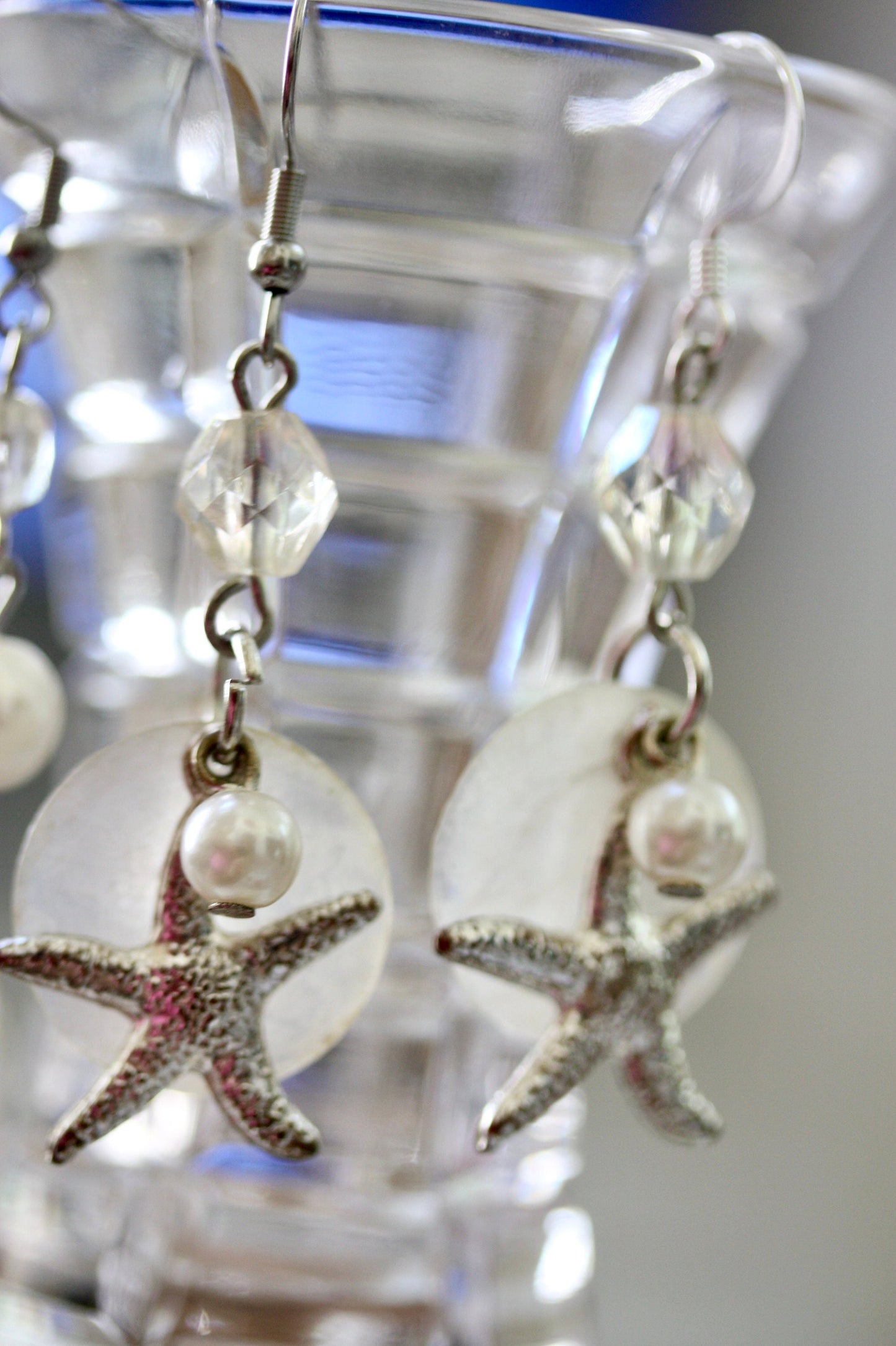Capiz shell, faux pearl and silvertone starfish beach themed dangle earrings