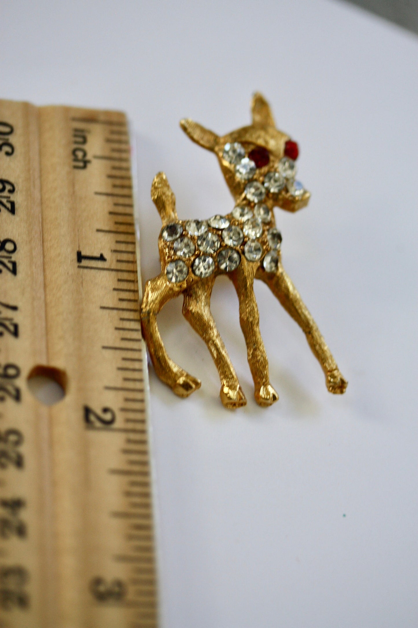 Charming vintage reindeer pin loaded with rhinestones