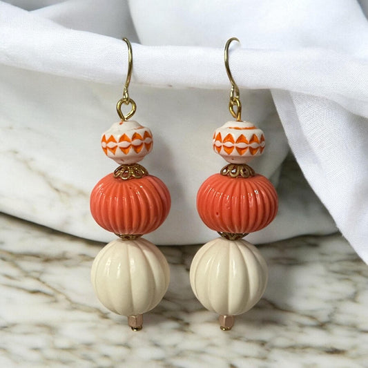 Orange & cream dangle earrings - vintage bead with orange motif combined with cream and orange colored vintage melon ball beads