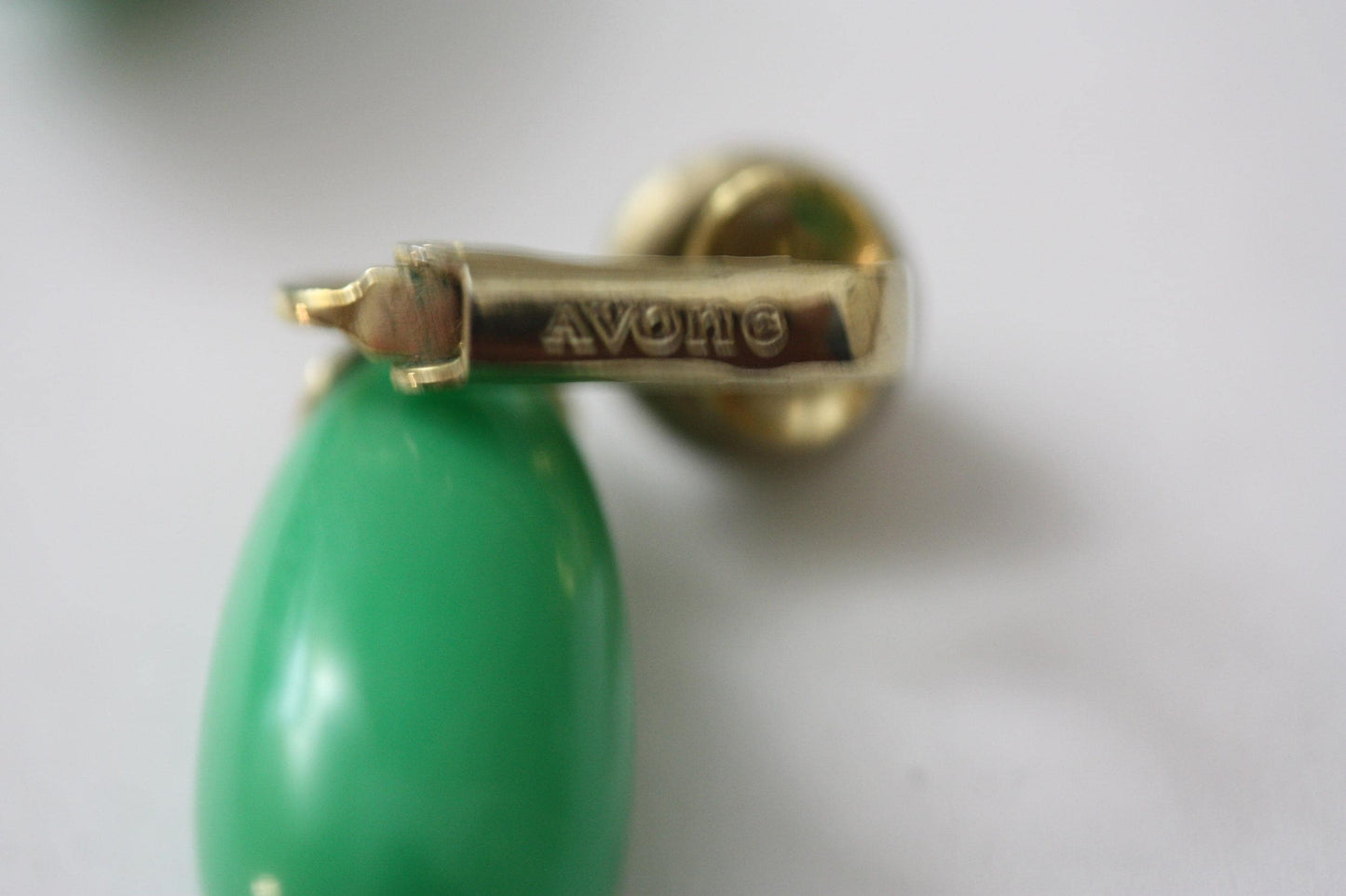 Green and white vintage Avon clip on dangle earrings