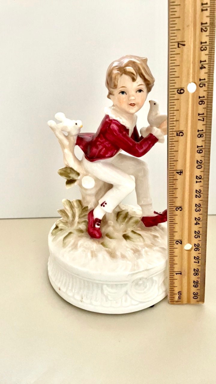 1977 Berman and Anderson stunning porcelain music box - boy dressed in red and white feeding birds