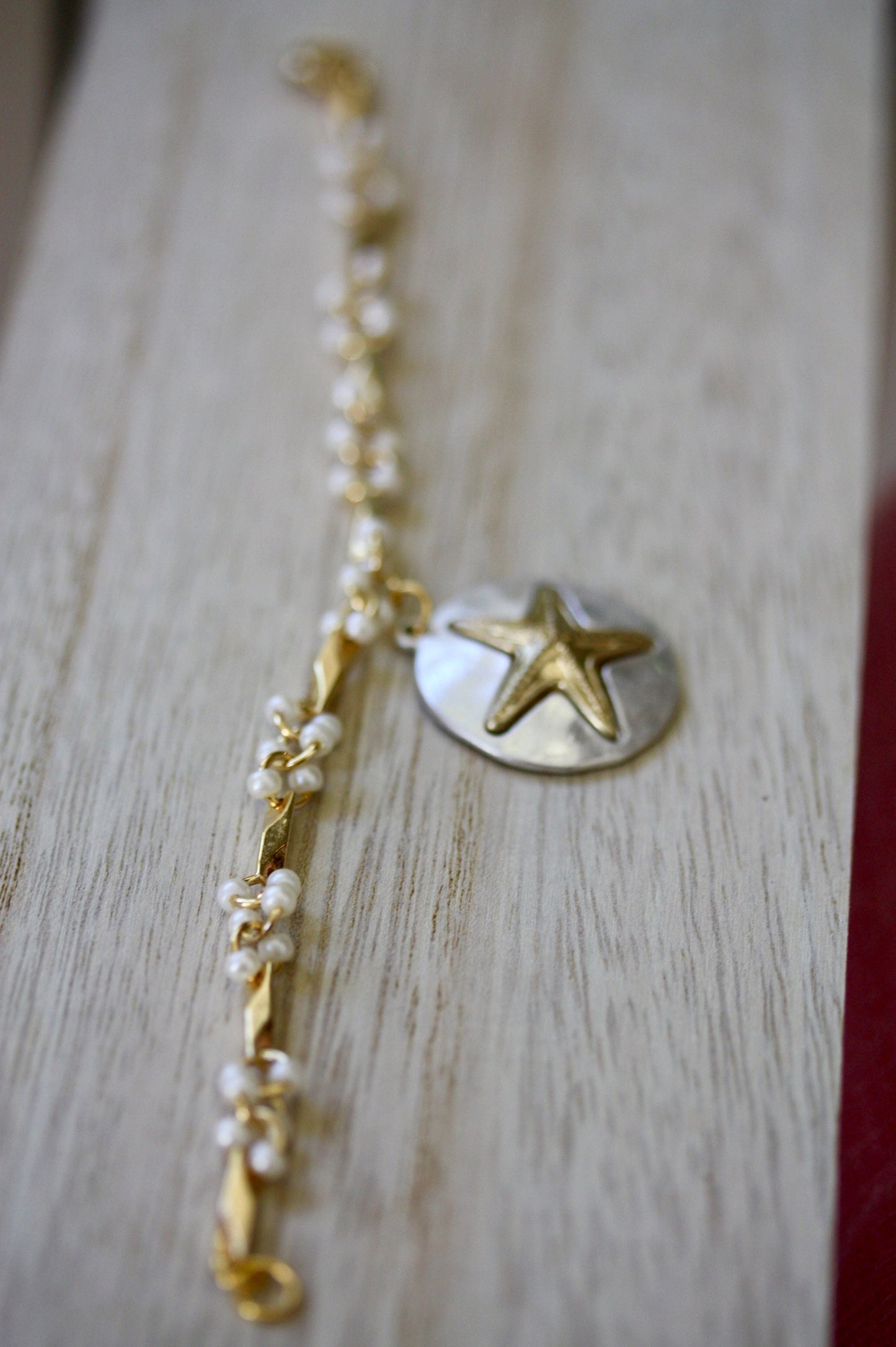 Handmade bracelet made with upcycled / repurposed vintage silver tone and gold tone starfish dangle, charm bracelet
