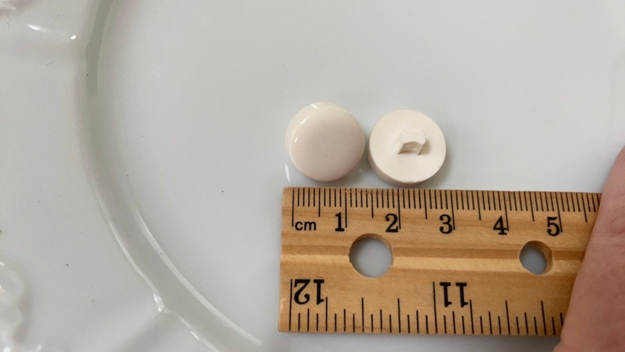 One dozen white round "puff" style cute vintage buttons