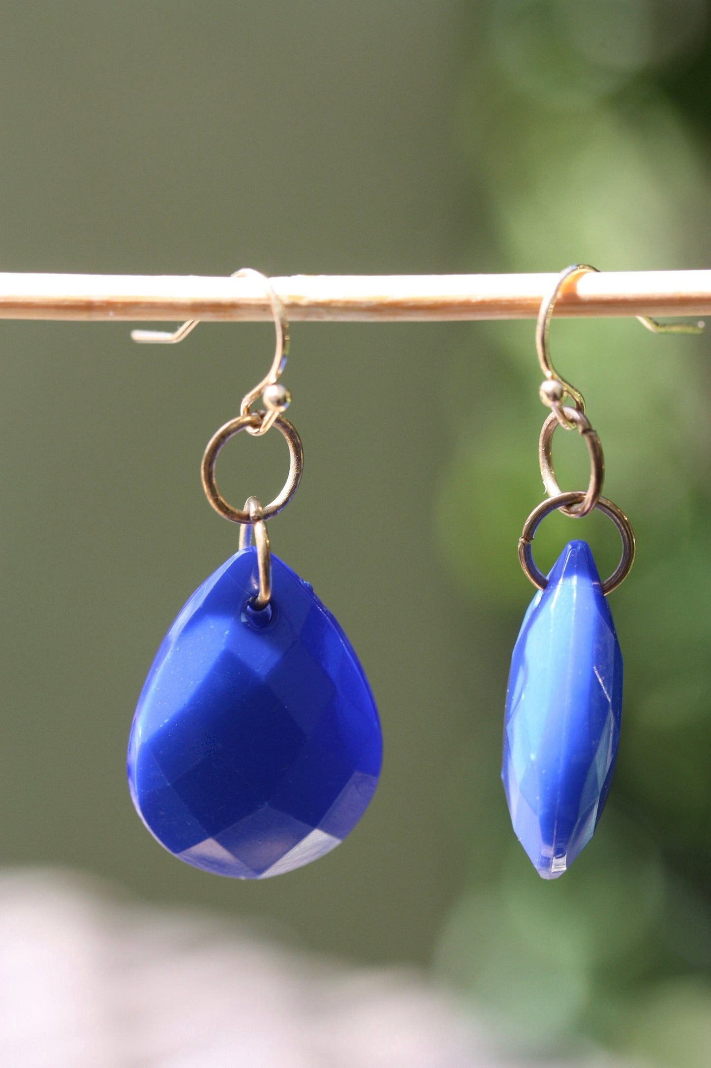 Royal blue faceted teardrop-shaped dangle earrings