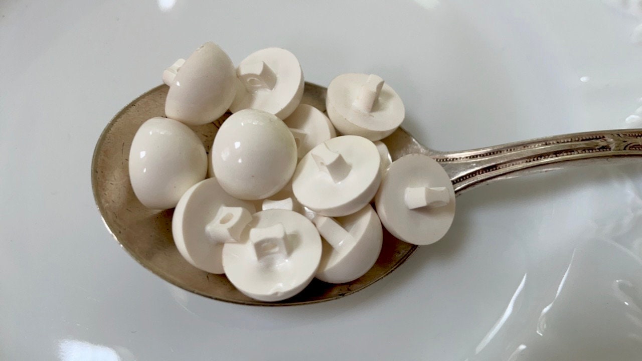 Lot of white domed top vintage buttons