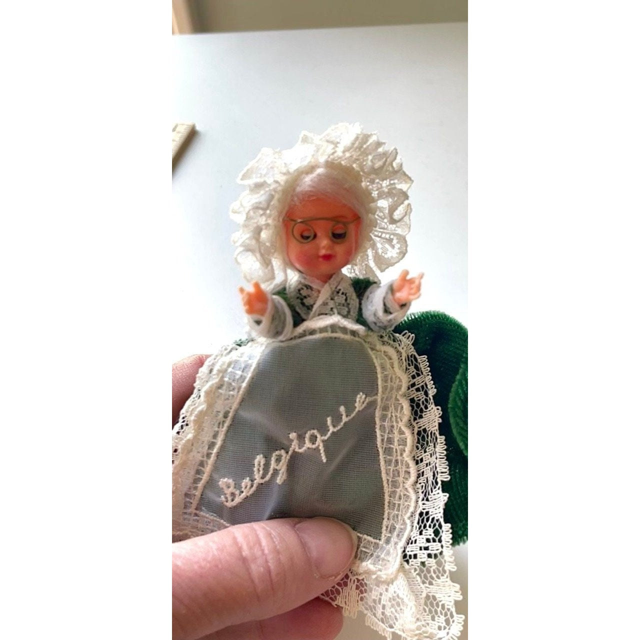 Stunning vintage collectible art baby Doll from Belgium with green velvet dress and lace overlay