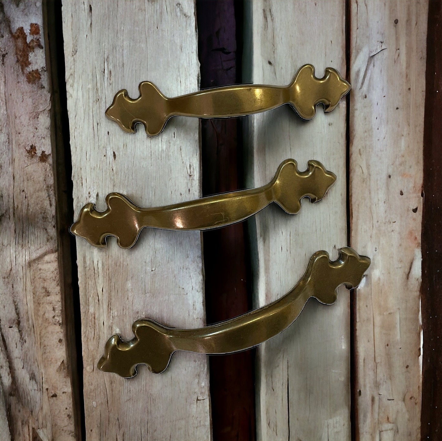 Set of three vintage brass? drawer pulls