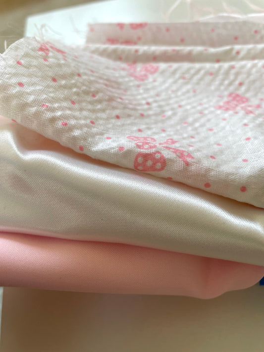 Lot of vintage fabric remnants - pink satin, white satin and white with pink bows