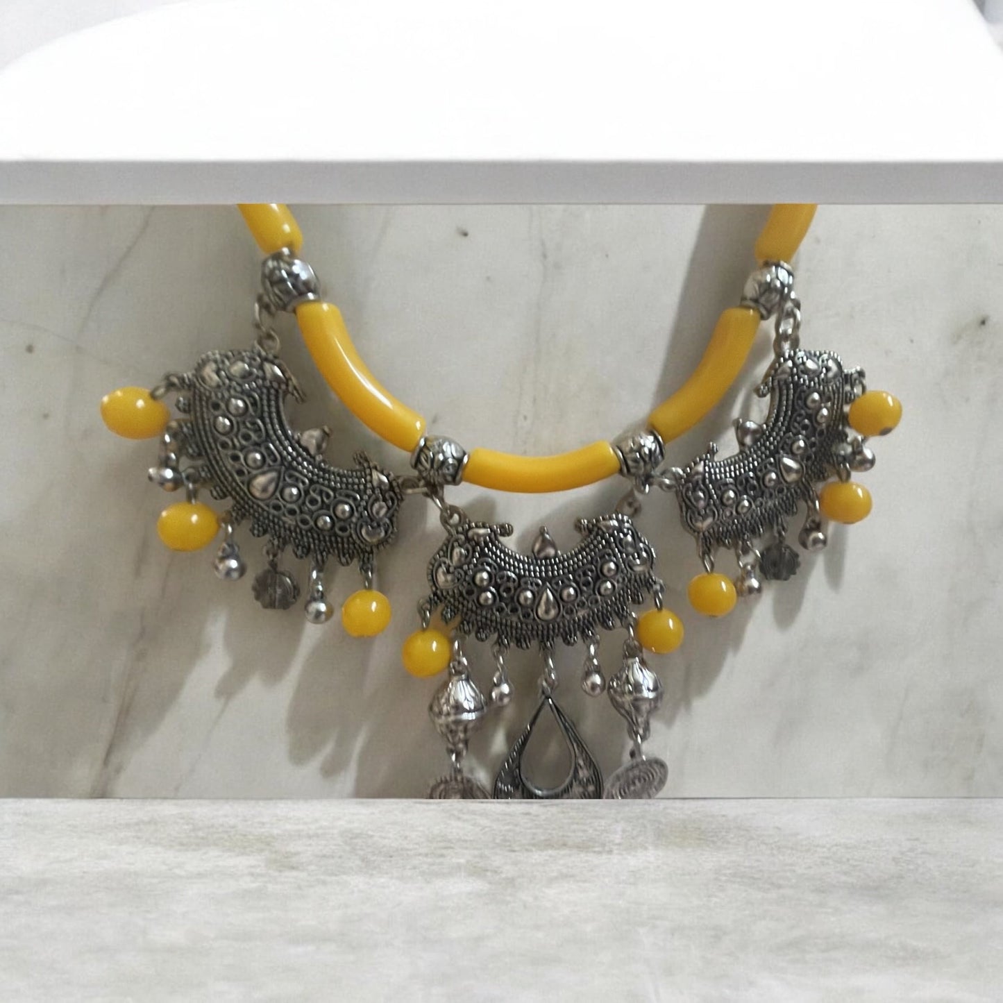Exotic Indian style necklace with yellow beaded balls/tubes and ornate silver trim