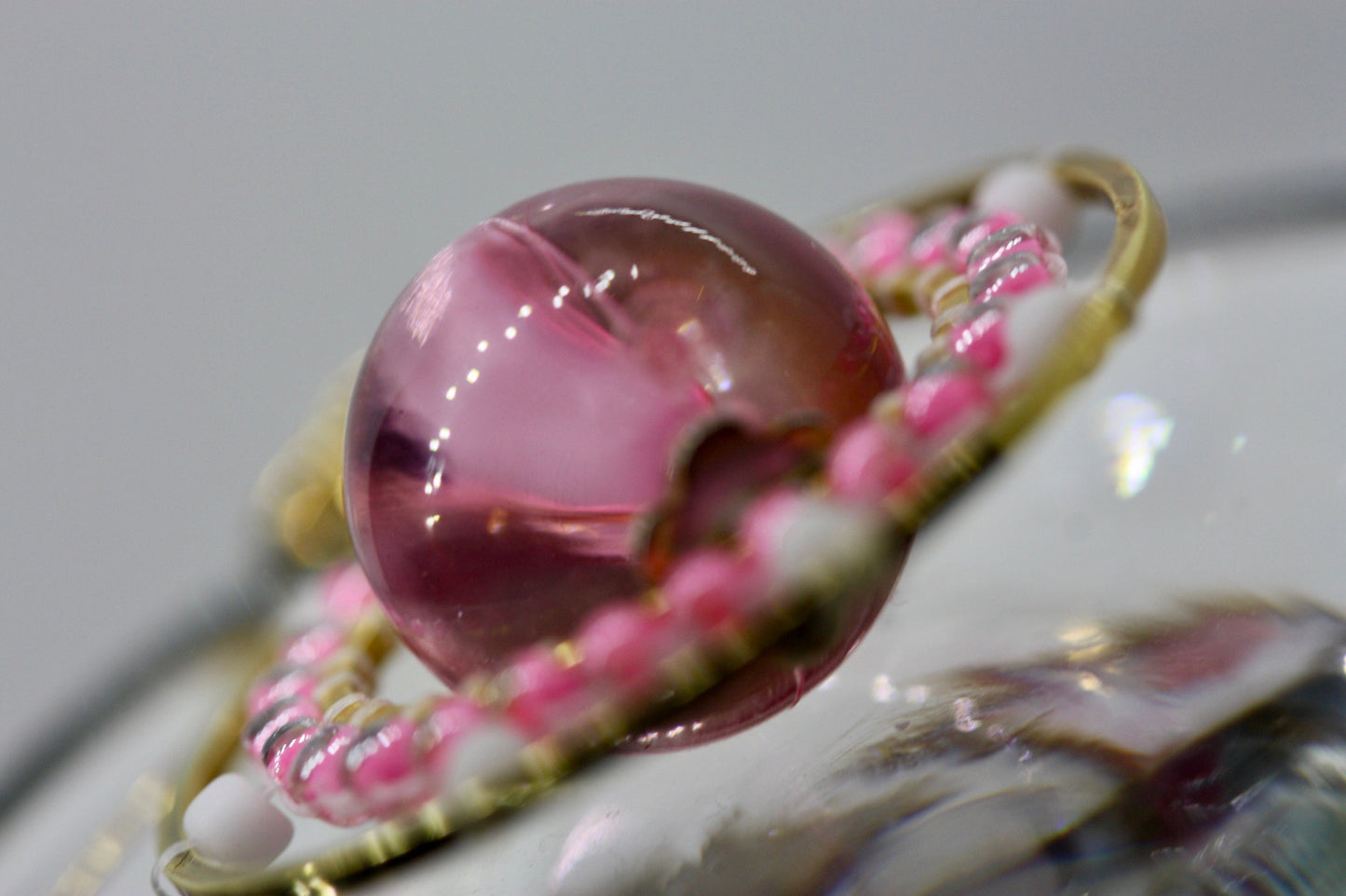Pink and white intricate beadwork small circular dangle earrings