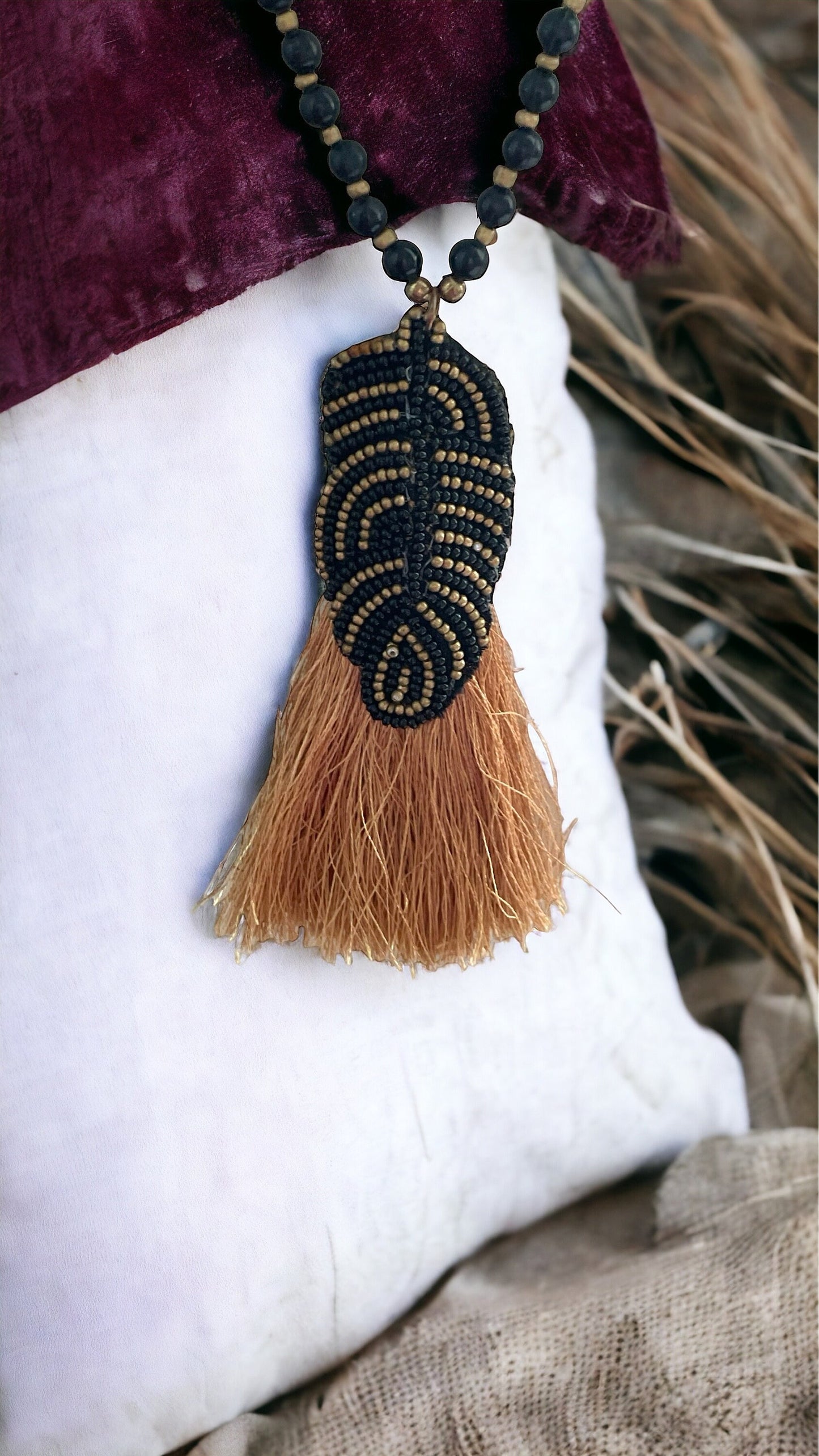 Stunning and unique hand beaded vintage artisan black and gold tassel necklace