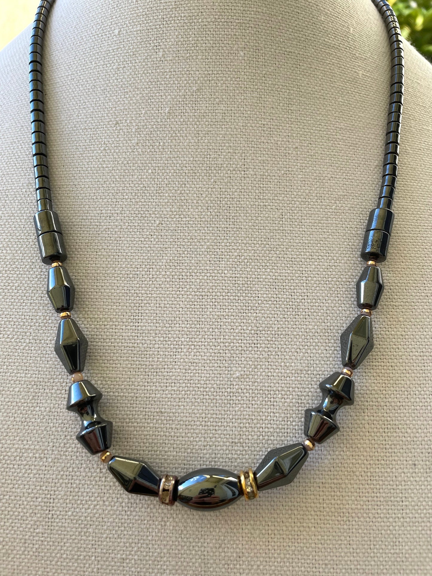 Vintage hematite necklace with uniquely shaped hematite beads and rhinestone spacers