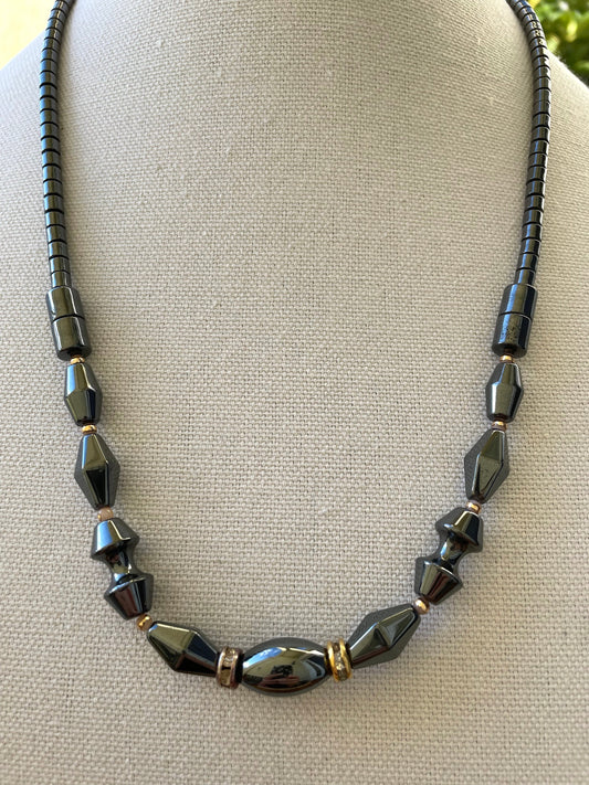Vintage hematite necklace with uniquely shaped hematite beads and rhinestone spacers