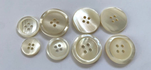 Lot of vintage mother of pearl buttons - assortment of medium and large sizes