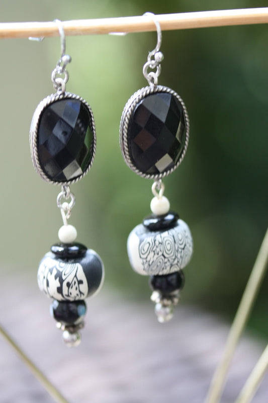 Black and white mixed media earrings made of upcycled polymer clay, combined with vintage black faux crystal, metal and glass spacer beads