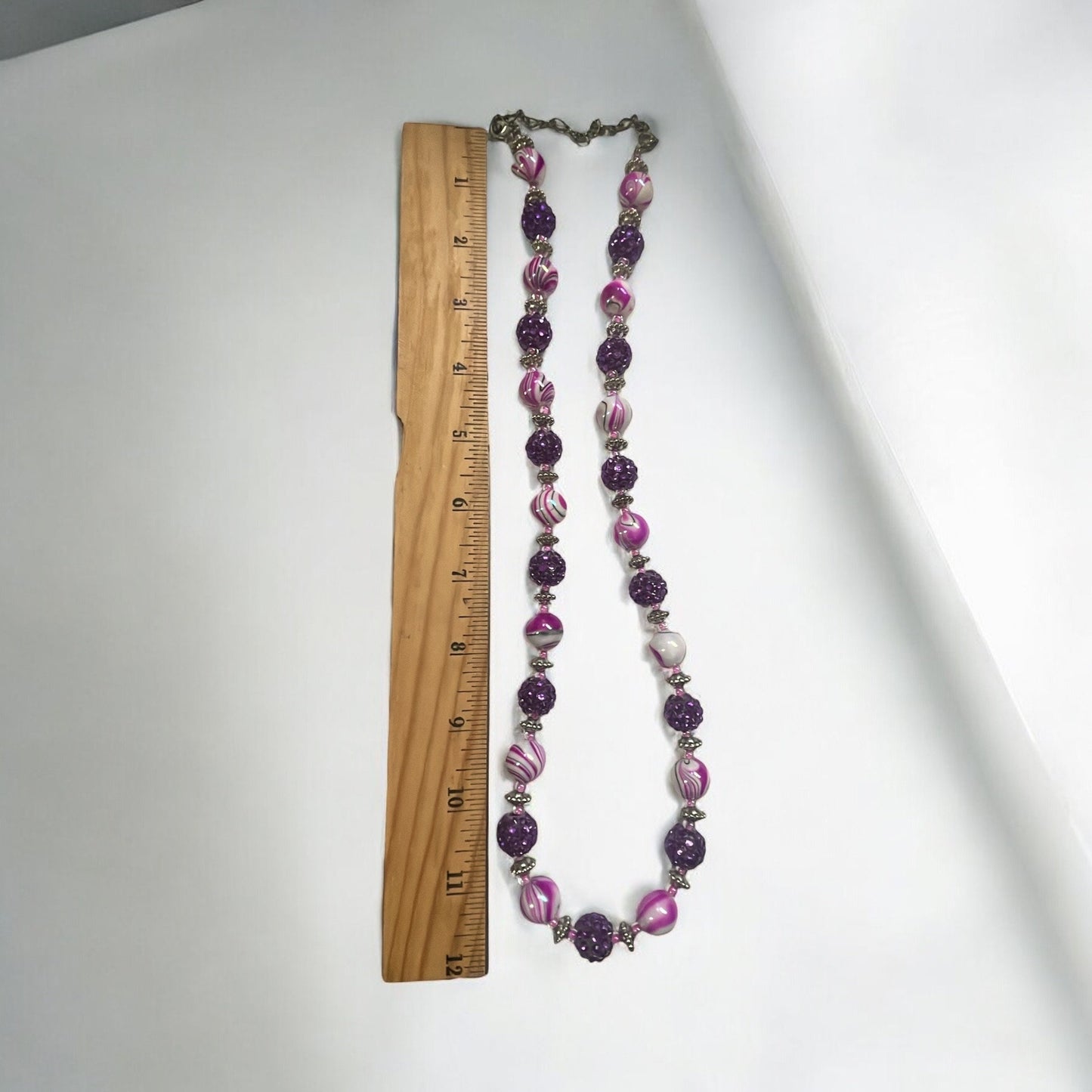 Shades of pinkish purple swirled vintage necklace with purple rhinestone beaded balls